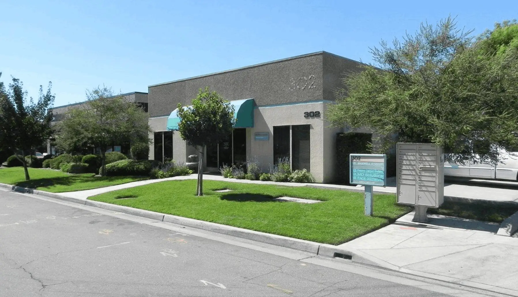 A building with grass on the front of it